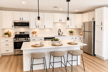 Grove City apartment for rent - A modern kitchen with white cabinets and a large island.