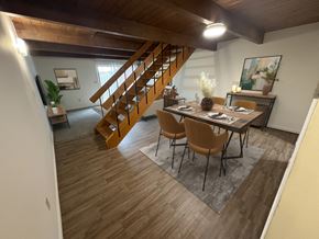 Dayton townhouse for rent - A dining room with a wooden table and chairs.