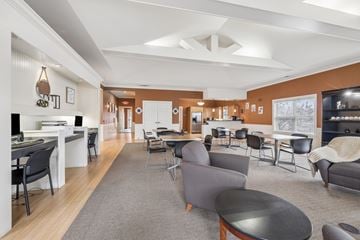Columbus apartment for rent - A living room with a grey rug and a black table.