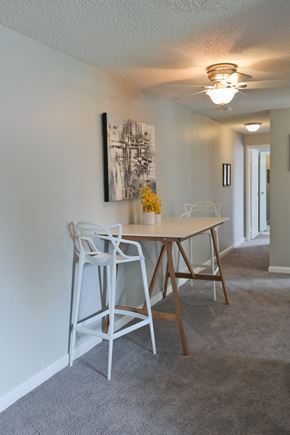 Columbus apartment for rent - a dining area with a table and chairs and a ceiling fan