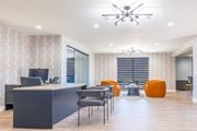 Kettering townhouse for rent - an office with a desk and chairs and a conference room