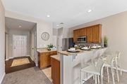 Cincinnati apartment for rent - A kitchen with a white counter top and a white fridge.