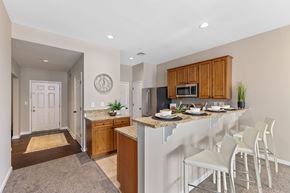 Cincinnati apartment for rent - A kitchen with a white counter top and a white fridge.