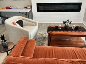 Columbus apartment for rent - A living room with a fireplace and two chairs.
