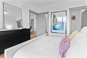 Cincinnati apartment for rent - A bedroom with a large bed and a painting on the wall. at The Ridge Apartments, Cincinnati