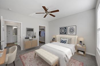 A bedroom with a bed and a ceiling fan