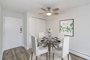 Cincinnati apartment for rent - a dining room with a table and chairs and a ceiling fan