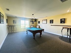 Maineville apartment for rent - Game room with pool table and pendant lighting at The Falls at Landen Apartments, Maineville