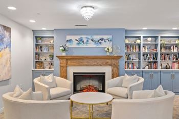 A living room with a fireplace and couches