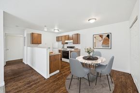 Lima apartment for rent - A kitchen with a table and chairs in the middle of the room.