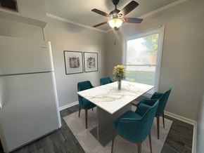 Oregon townhouse for rent - a dining room with a fridge and a ceiling fan