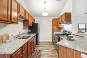 Ft Wright apartment for rent - Galley kitchen with granite countertops and oak cabinets at Wrights Point Apartments, Kentucky, 41011