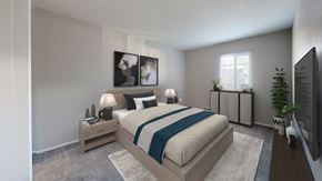 Oregon apartment for rent - A modern bedroom with a large bed and a television.