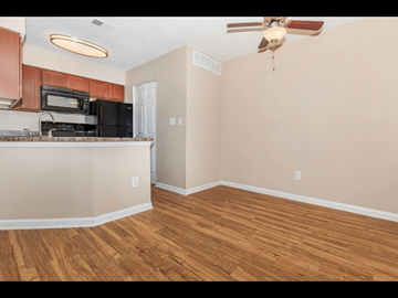Indianapolis apartment for rent - A kitchen with wooden floors and a ceiling fan.