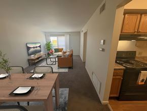 Dayton townhouse for rent - A modern kitchen with a dining table set for two.