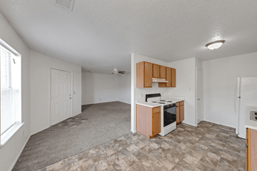 Franklin apartment for rent - A kitchen area with a stove top oven and a refrigerator.