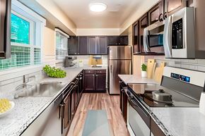 Cincinnati apartment for rent - a kitchen with stainless steel appliances and marble counter tops at Olde Towne in Kenwood, Ohio, 45243