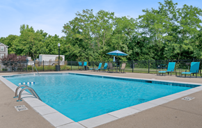 Cincinnati townhouse for rent - Swimming pool with blue chairs and a fence around it at Galbraith Pointe Apartments and Townhomes*, Ohio, 45231