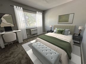 Bowling Green townhouse for rent - a bedroom with a bed and a desk with a laptop
