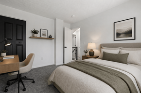 Findlay apartment for rent - A bedroom with a large bed and a chair.