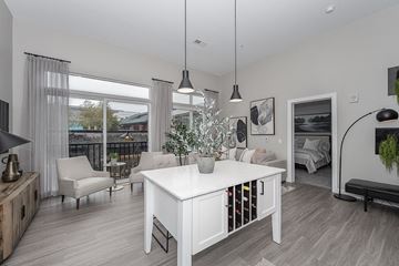 Liberty Township apartment for rent - an open living room and dining room with a white table and chairs