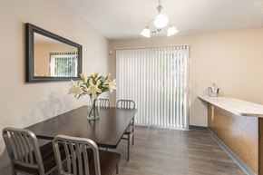 Columbus apartment for rent - a dining room with a table and chairs and a window at Parkside at Maple Canyon Apartments, Columbus, OH
