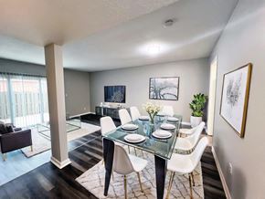 Indianapolis apartment for rent - A dining room with a glass table and white chairs at A62 Apartments, Indianapolis, IN 46220