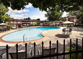 Indianapolis apartment for rent - A pool surrounded by a black fence at Fountain Parc Apartments, Indianapolis, IN