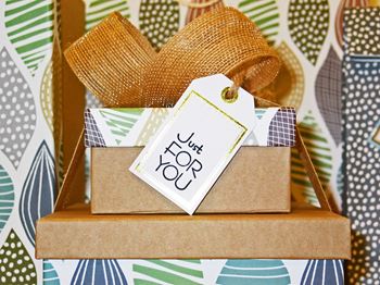 A gift box with a tag that says just joy