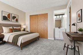 Findlay apartment for rent - A bedroom with a bed, desk, and chair.