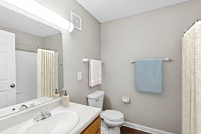 Indianapolis apartment for rent - A bathroom with a white toilet  at Waterfront Pointe, Indianapolis, IN 46214