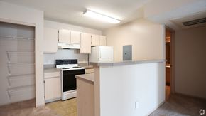 Columbus apartment for rent - A kitchen with white cabinets and a stove top oven.at Sharon Glen, Columbus, 43229