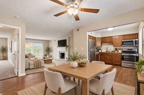 Cincinnati apartment for rent - A modern dining room with a wooden table and chairs.