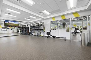 Alexandria apartment for rent - A gym with a variety of equipment including treadmills, weights, and exercise machines at Rose Hill Apartments, Alexandria, Virginia