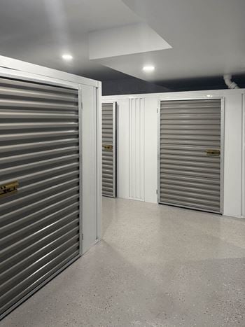 A storage facility with closed grey doors.