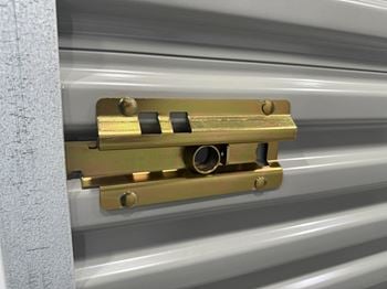 A close-up of a latch mechanism on a piece of equipment.
