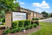 Falls Church apartment for rent - A sign for Tysons Glen Apartments and Townhomes stands in front of a row of buildings.
