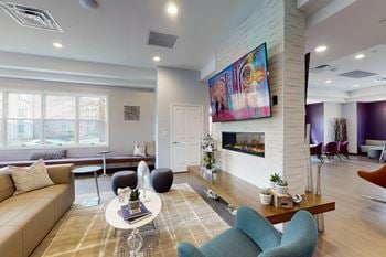A living room with a couch and a fireplace