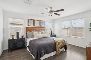 Casa Grande apartment for rent - A bedroom with a bed, nightstand, and a ceiling fan.