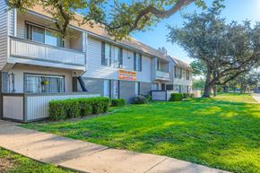 Carrollton apartment for rent - Apartment complex with a sign that says "For Rent".