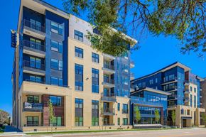 Colorado Springs apartment for rent - A modern apartment building with blue and beige facades.