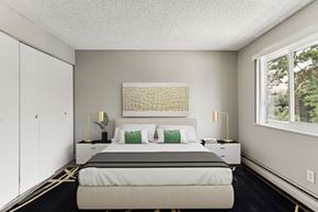 Colorado Springs apartment for rent - a bedroom with a bed and a large window