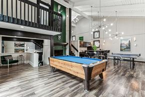 Colorado Springs apartment for rent - a game room with a pool table and a bar
