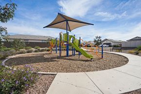 Casa Grande apartment for rent - A playground with a yellow slide and a shaded area.