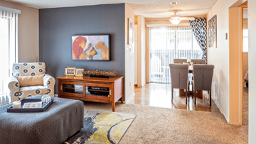 Northglenn apartment for rent - a living room and dining room with a couch and a table