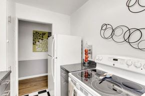 Colorado Springs apartment for rent - Aspire Palmer Park Stove Fridge Hall view