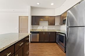 Fort Collins apartment for rent - A kitchen with a granite counter top and stainless steel appliances.