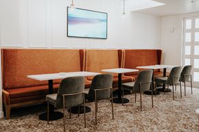 Salt Lake City apartment for rent - a dining room with tables and chairs and a orange couch