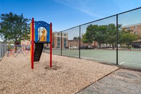 Denver apartment for rent - a playground with a swing set and a tennis court