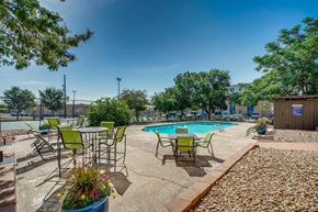 Denver apartment for rent - our apartments have a pool and patio with chairs and tables